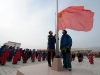 Students salute at the national flag-raising ceremony on the first day of new semester in the School for Nationalities in Tianzhu Tibet Autonomous County, northwest China's Gansu Province, Feb. 25, 2009. Tibetans across China are celebrating the 50th Tibetan New Year after the Democratic Reform with their old traditions.